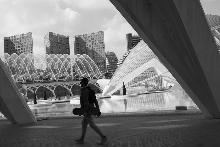 Skater walking through City of arts and sciences