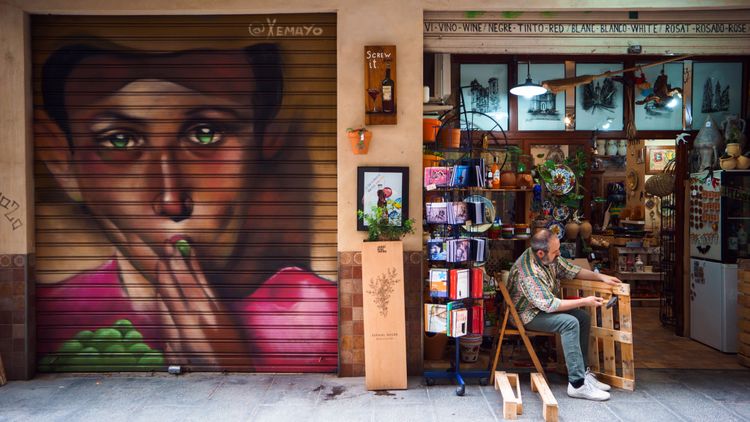 Craftsman in front of his shop