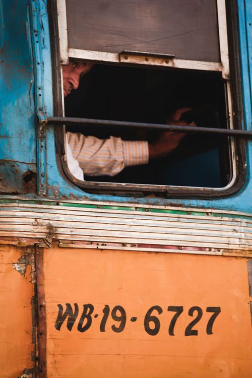 Man looking through the bus's window