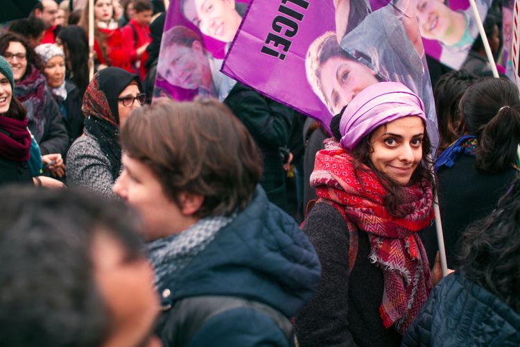 Portrait of a woman in the middle of the crowd 