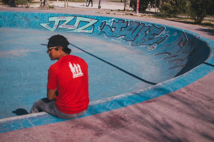 Rider sitting at skatepark