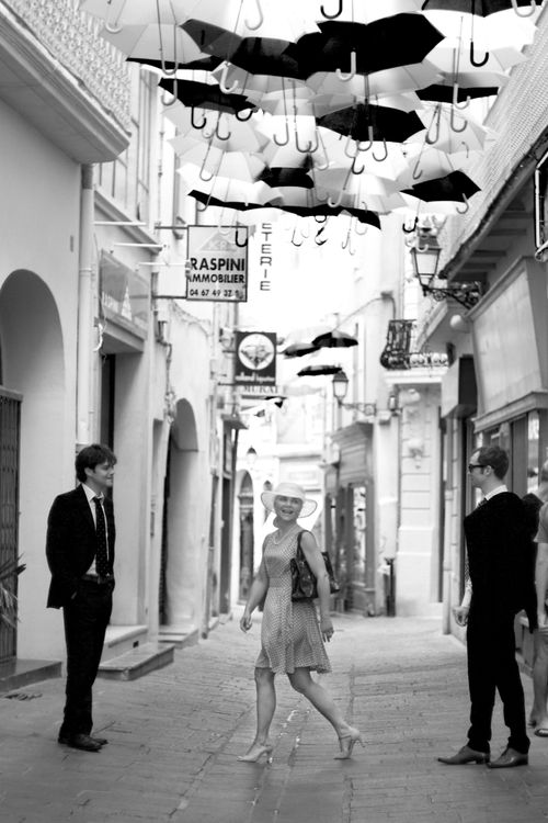 street of umbrellas, people going to wedding