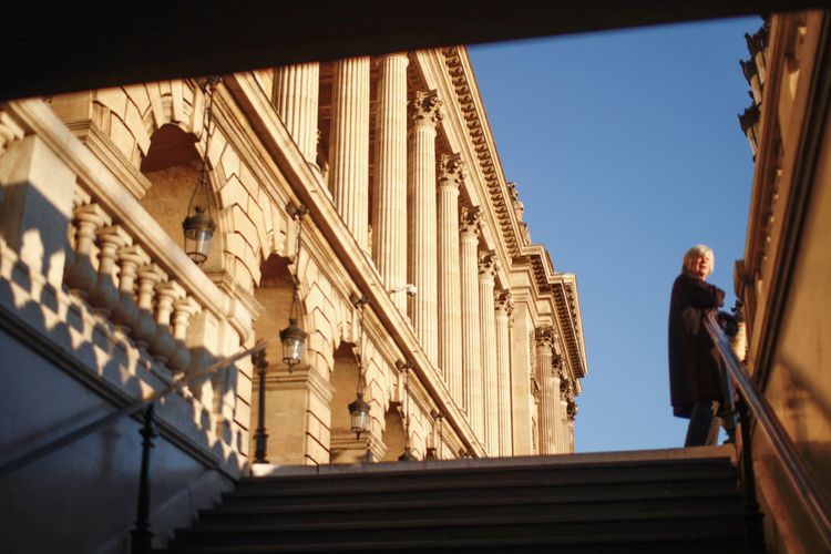 Woman getting out of the metro station, Paris 2016